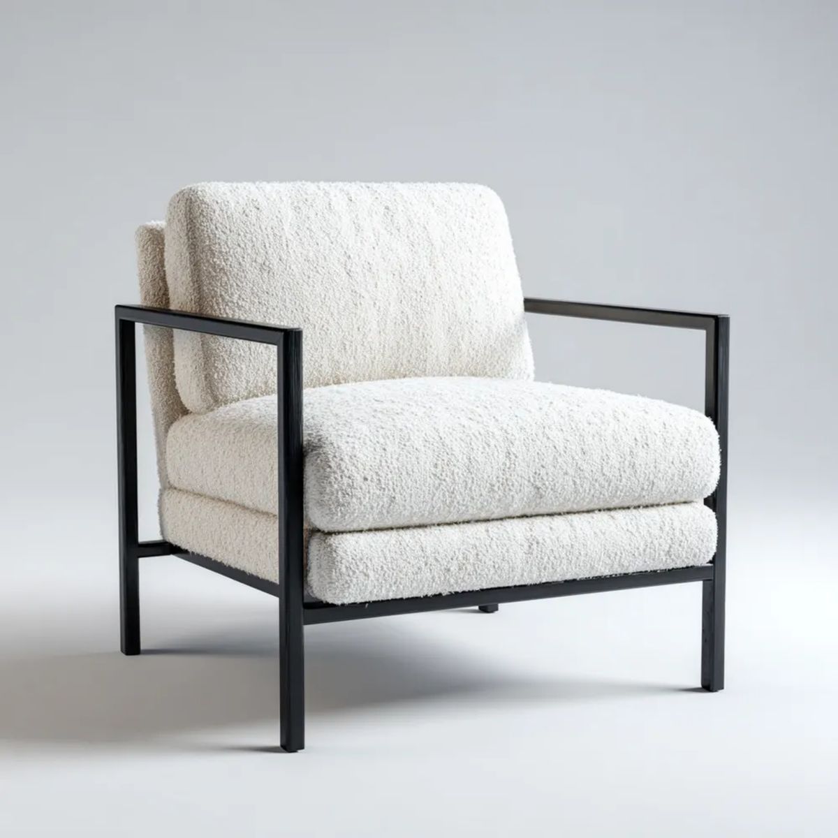 Kremowy fotel tapicerowany bouclé na czarnej stalowej ramie 76 x 80 x 78 cm