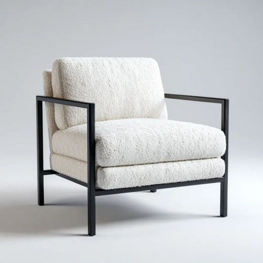 Kremowy fotel tapicerowany bouclé na czarnej stalowej ramie 76 x 80 x 78 cm